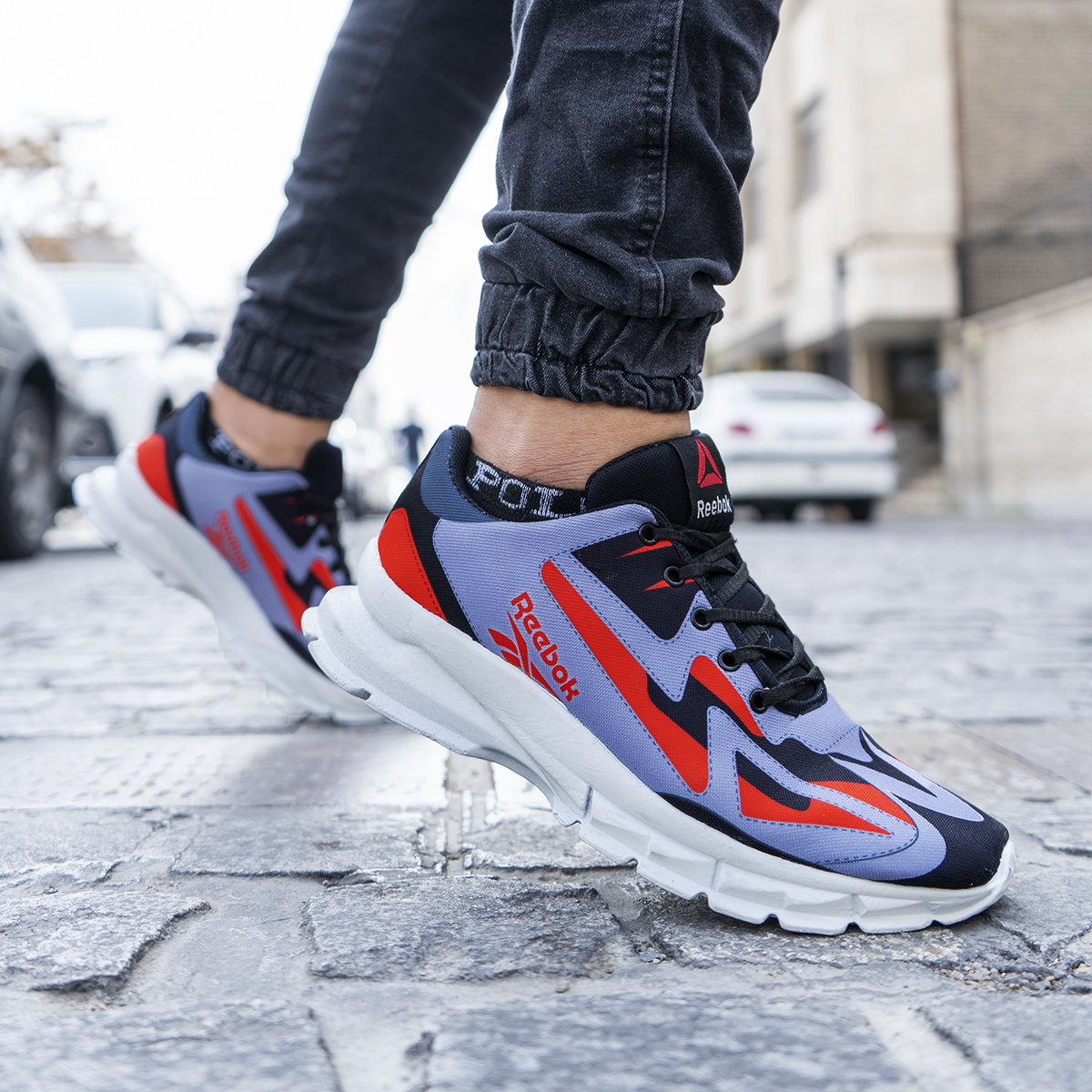 کفش ورزشی ریبوک طوسی قرمز مردانه مدل Ervan